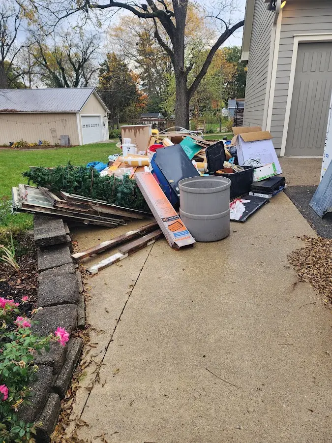 Dumpster being loaded with debris for 3 Yard Dumpster Rental in Abington